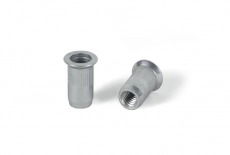 Riveting nut zinc with countersunk shoulder fluted open Bralo